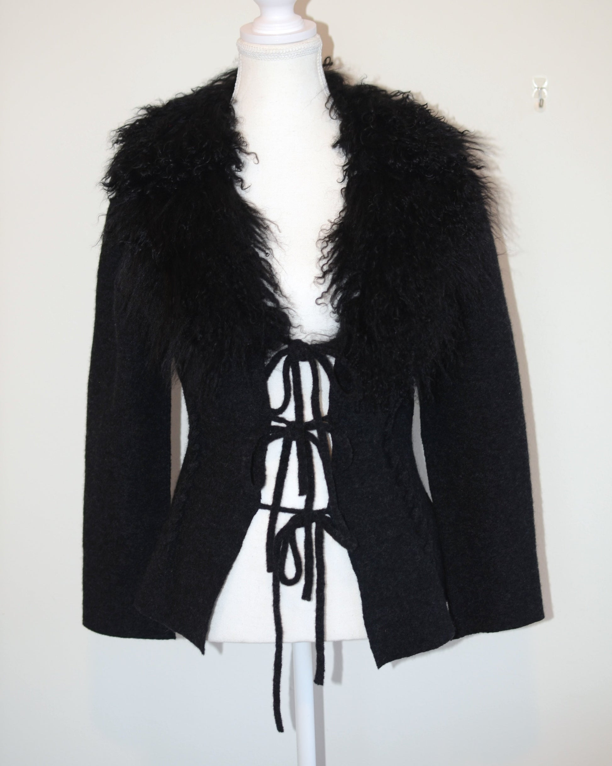 Black Roberto Cavalli jacket with faux fur  trim on a mannequin against a white background